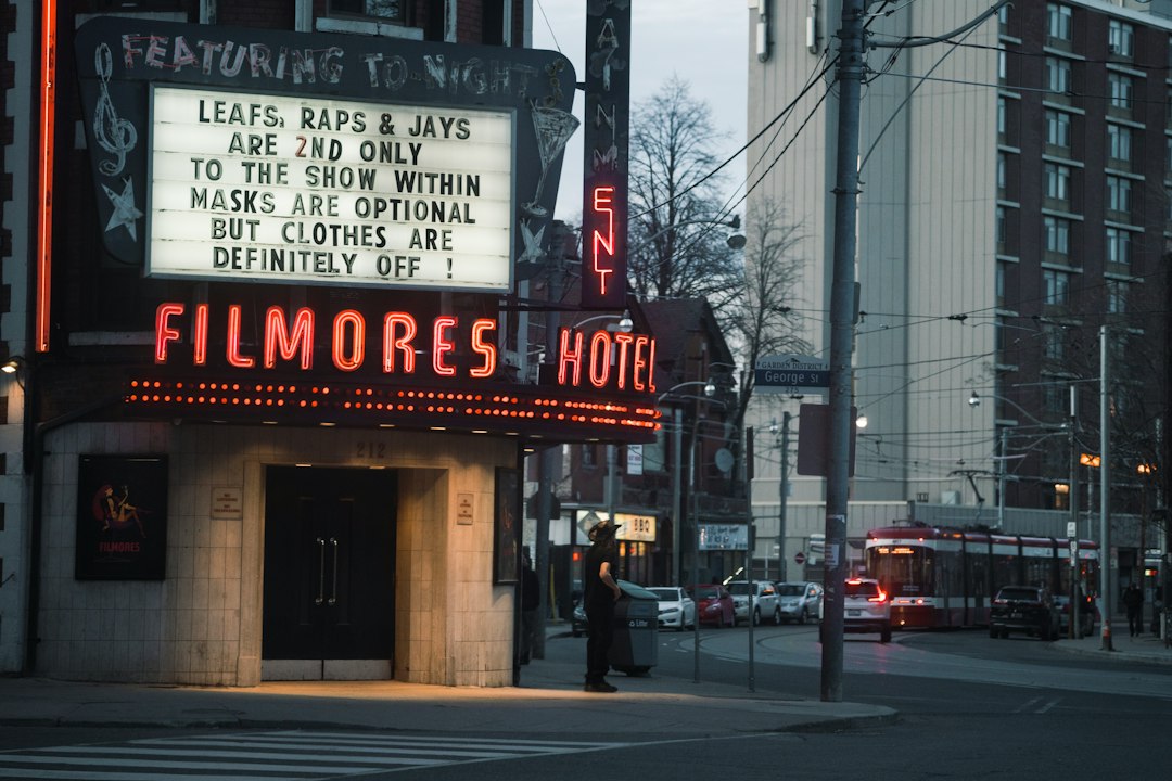 a theater marquee on the corner of a city street