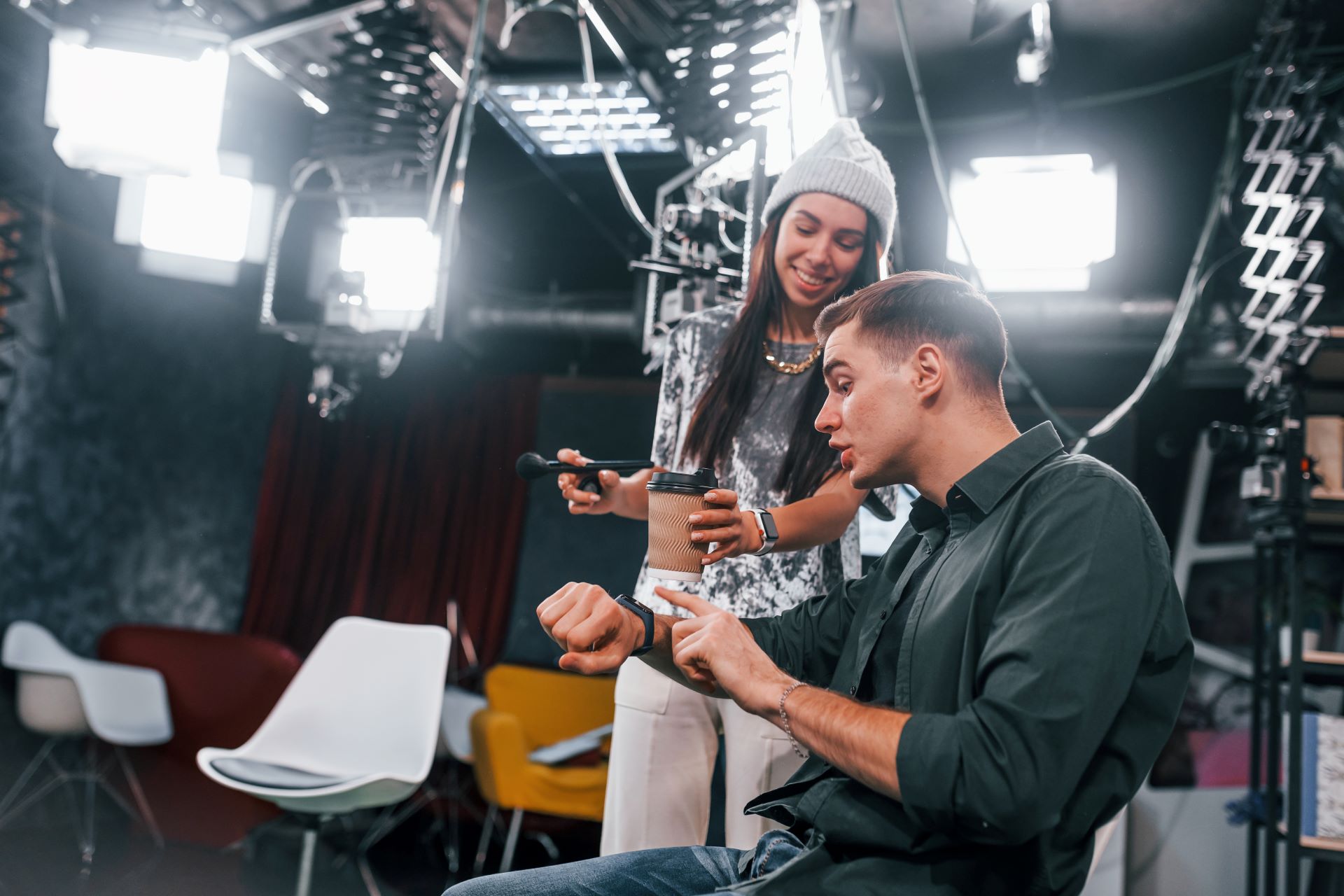 Film crew working together on set with cameras and lighting